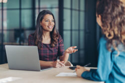 Two women talking during a job interview, illustrating the importance of finding a church CFO who is a strong fit for your ministry.
